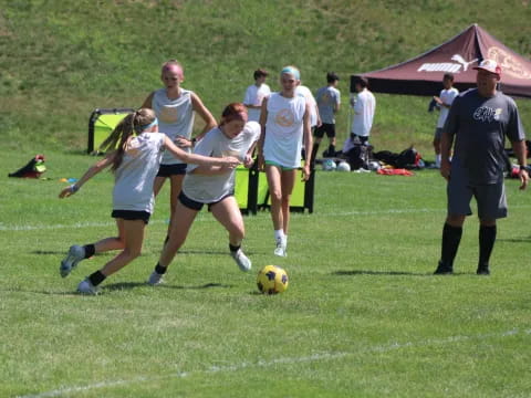 a group of people play football
