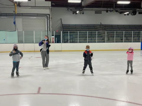 a group of people on an ice rink