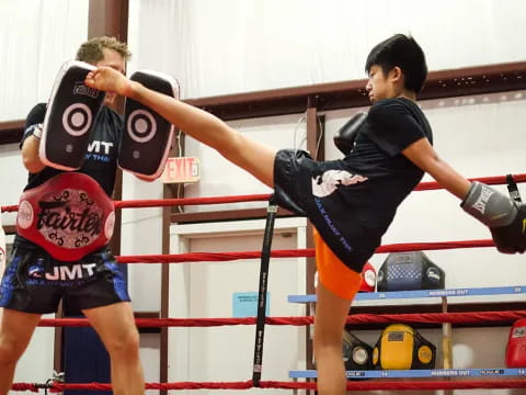 a couple of men in a boxing ring