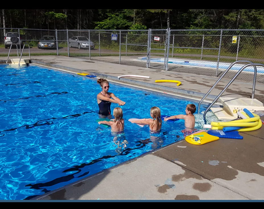 a group of people in a pool