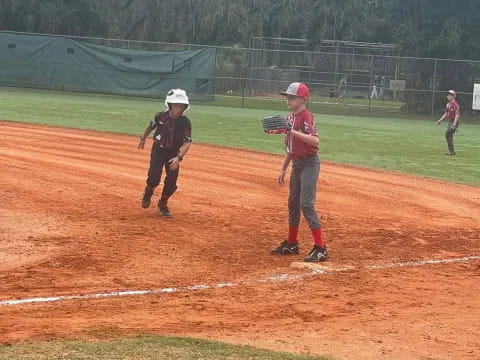 kids playing baseball on a field