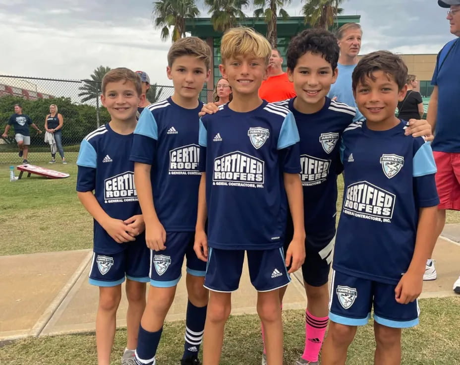 a group of boys in blue uniforms