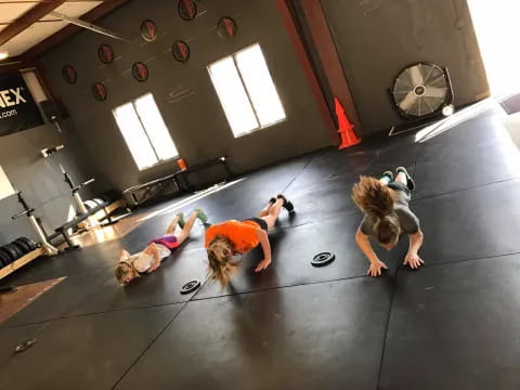a group of women doing yoga