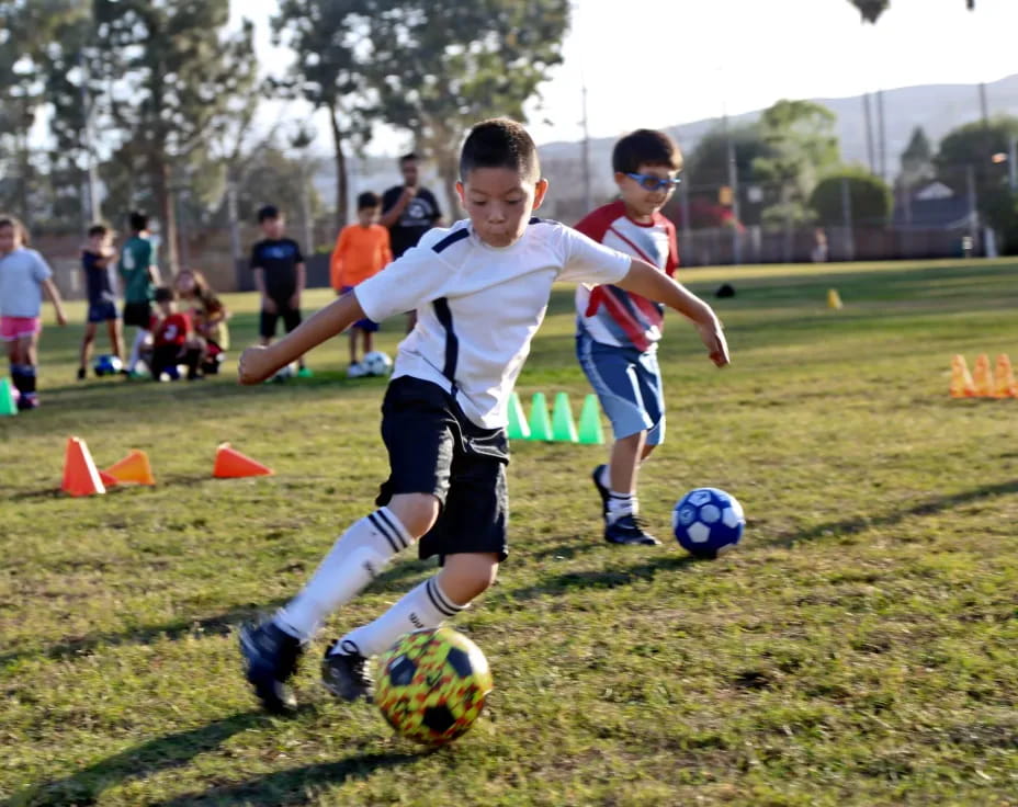 kids playing football on a field
