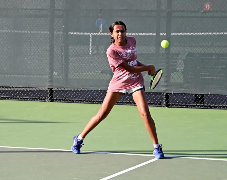 a woman playing tennis
