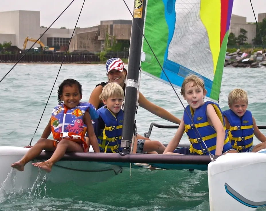 a group of kids in a boat