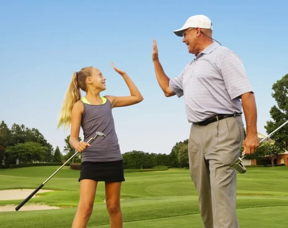 a man and a woman playing golf