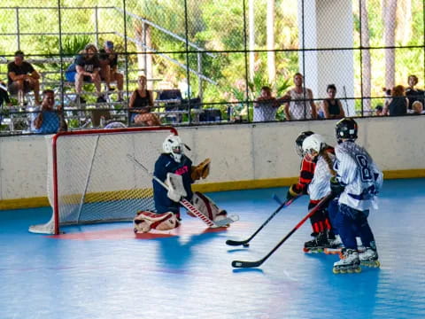 a group of people playing hockey