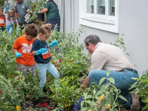 a man and a boy in a garden