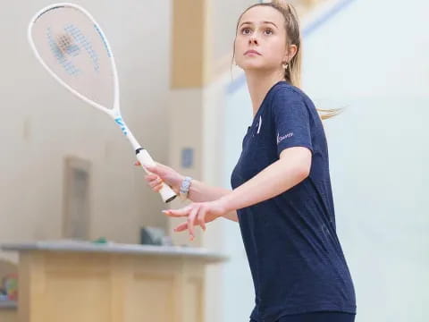 a person holding a tennis racket