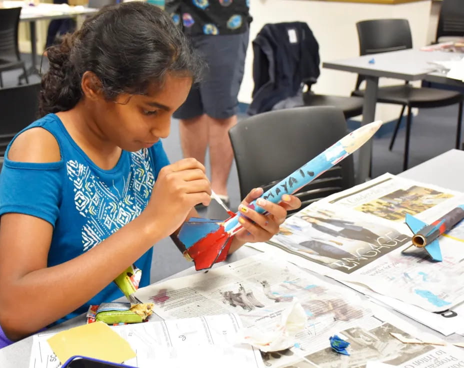 a young girl painting