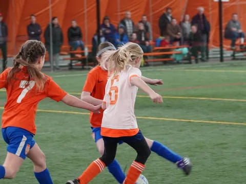 a group of girls playing football