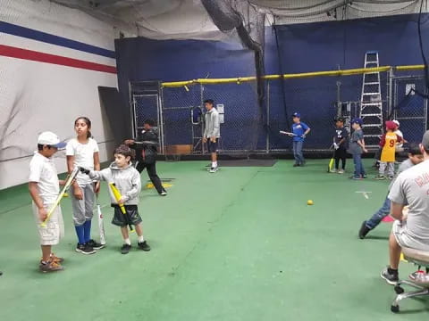 a group of kids playing baseball