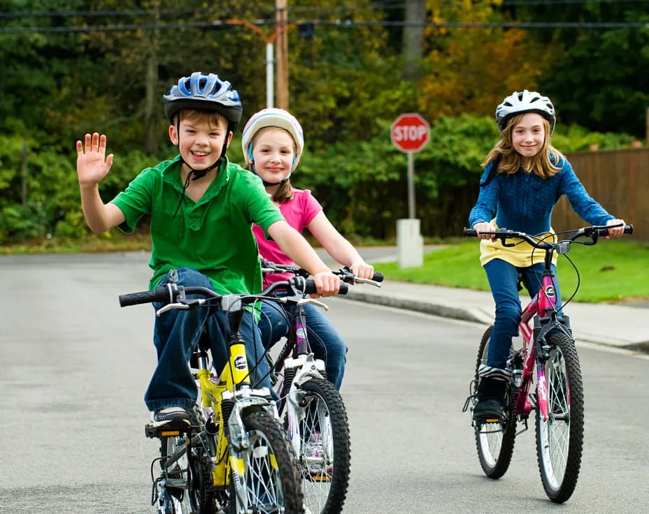 a group of kids riding bikes