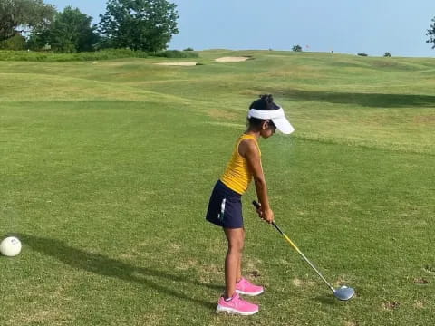 a person playing golf