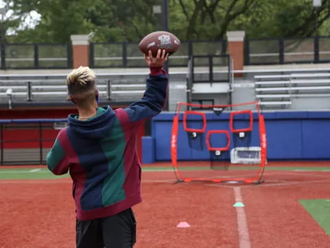 a boy throwing a ball