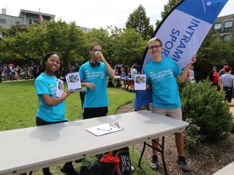a group of people holding signs