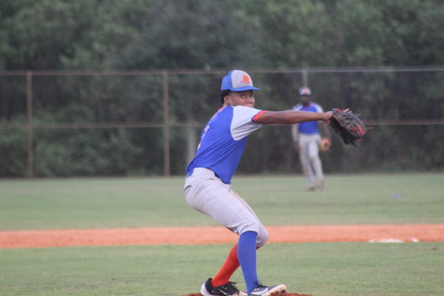 a baseball player throwing a ball