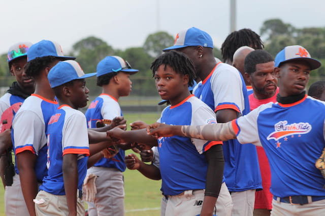 a group of people in blue shirts