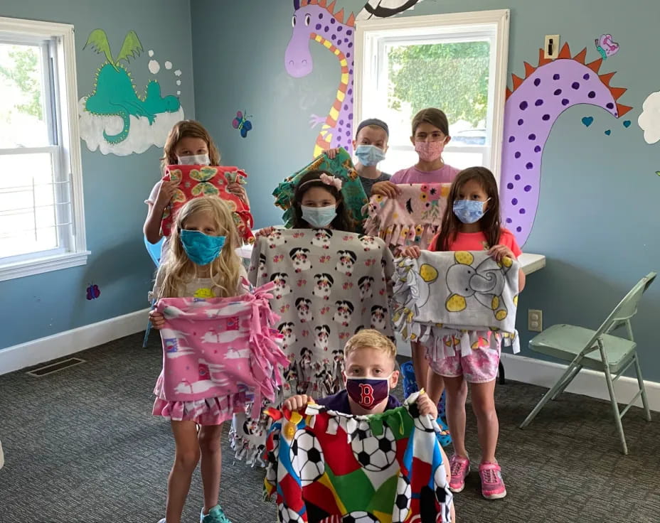 a group of children in clothing