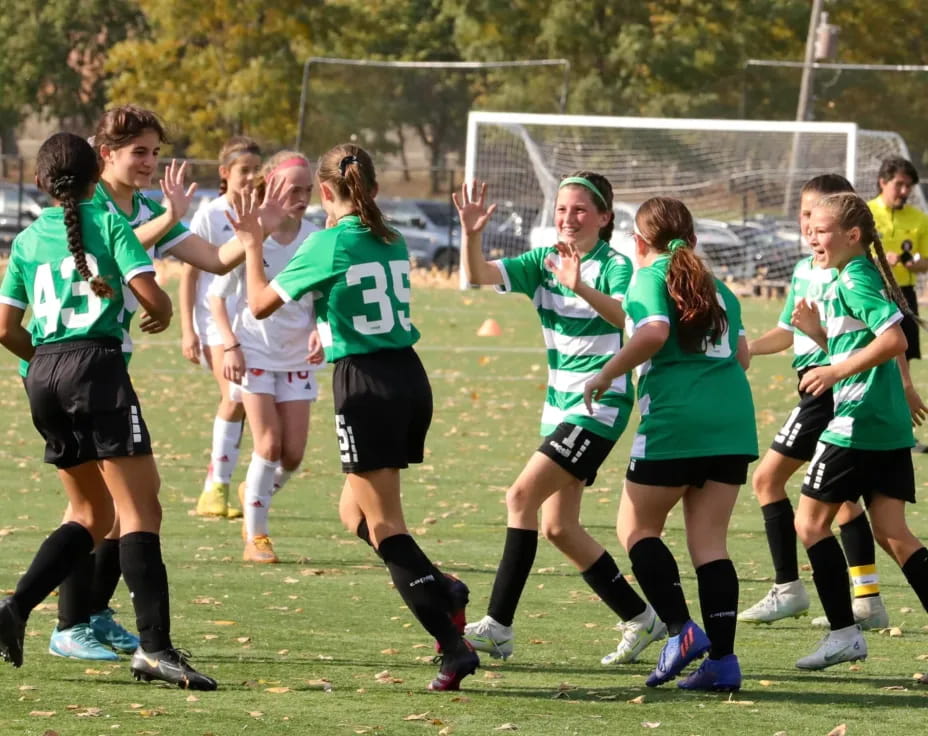 a group of girls playing football