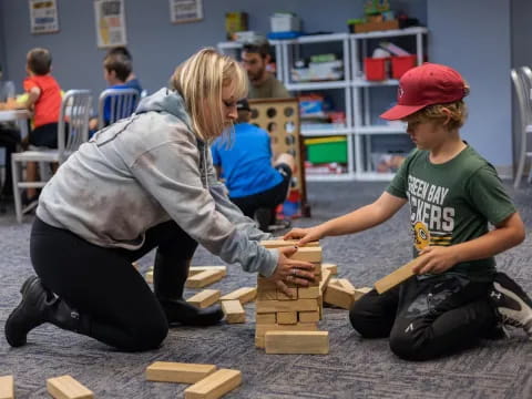 a person and a boy playing a game
