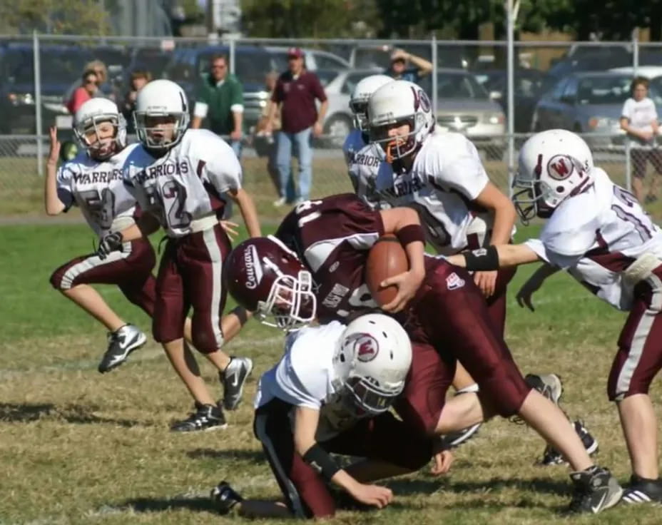 a group of people playing football