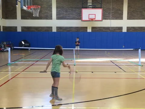 a group of people play tennis