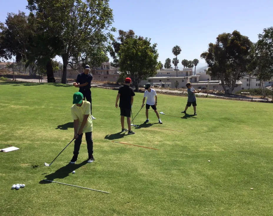 a group of people playing golf