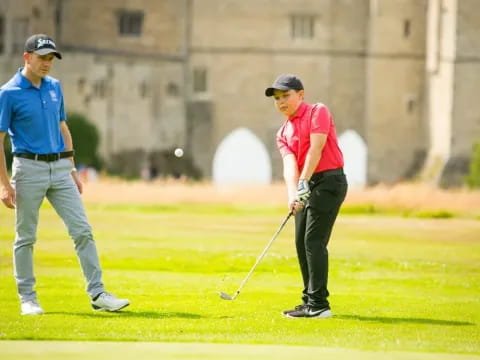 a few men playing golf