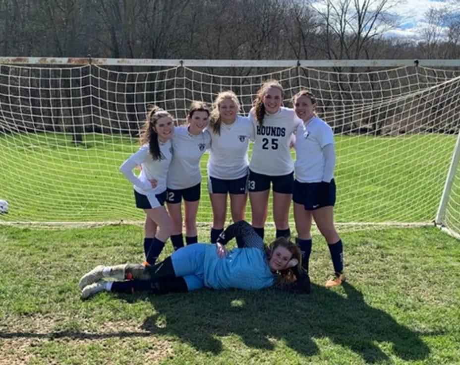 a group of girls playing football
