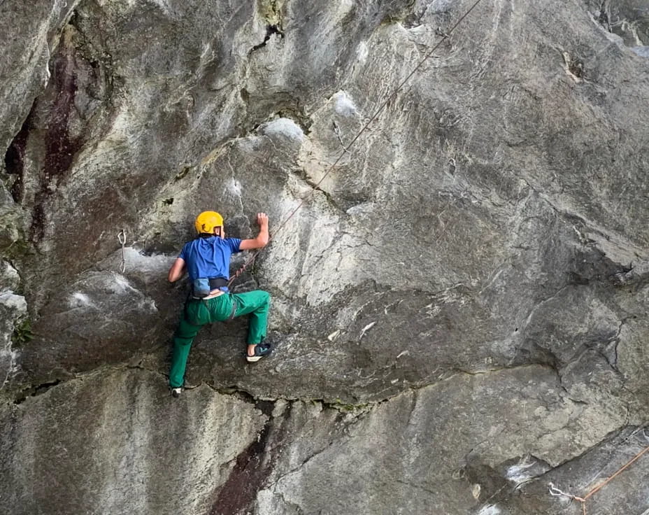 a man climbing a rock