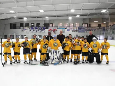a hockey team posing for a photo