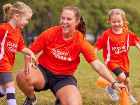 a group of girls playing football