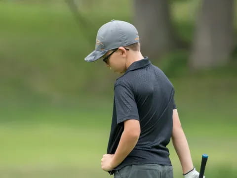 a person holding a golf club