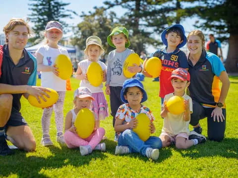 a group of kids holding balloons