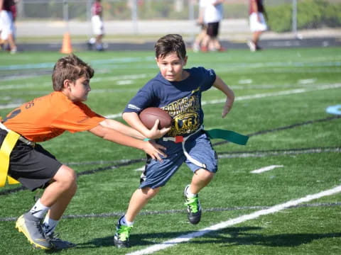 boys playing football on a field