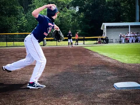 a baseball player throwing a ball