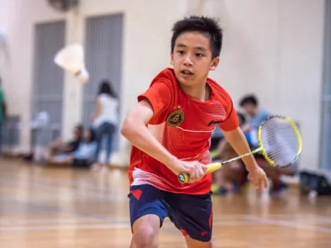 a boy playing tennis