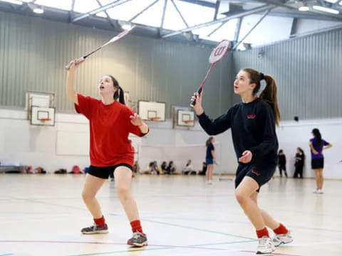 a couple of women playing hockey