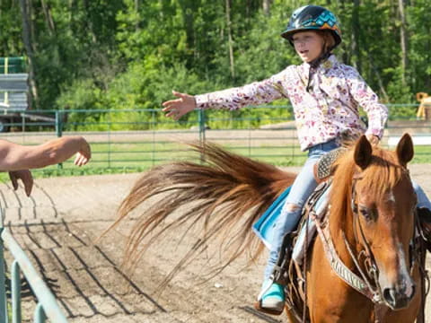 a girl riding a horse
