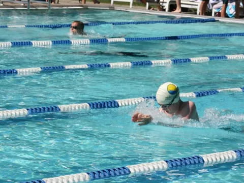 a person swimming in a pool