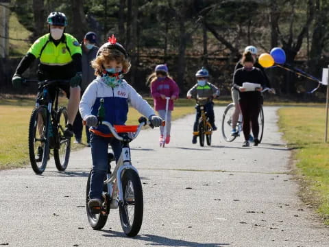 a group of people riding bikes