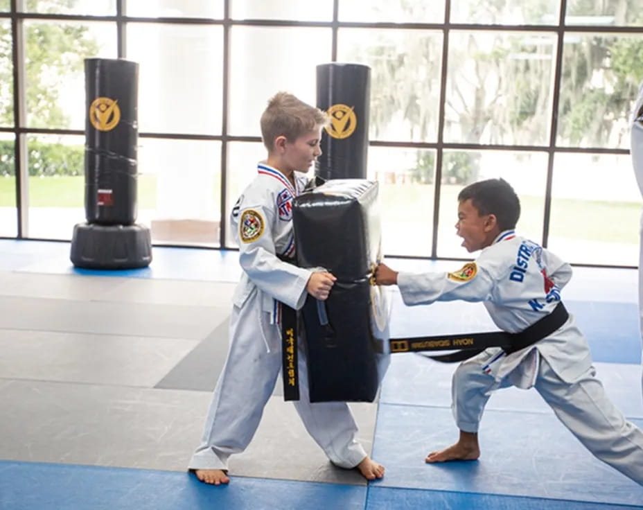 a group of men in karate uniforms