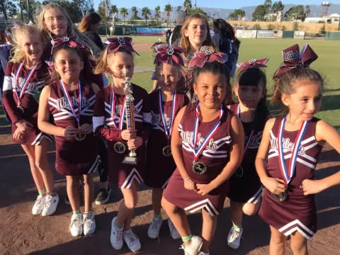 a group of girls wearing medals