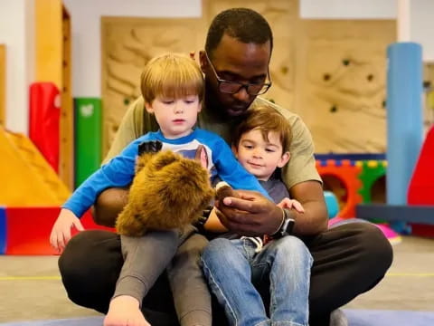 a person holding two children