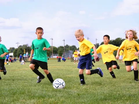 a group of kids playing football