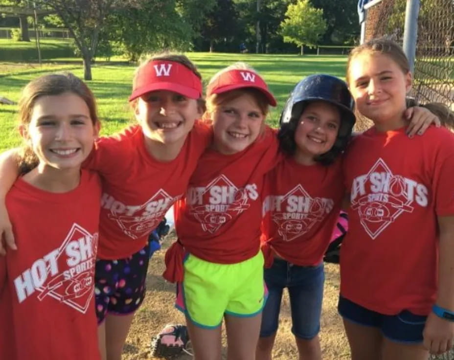 a group of girls posing for a photo