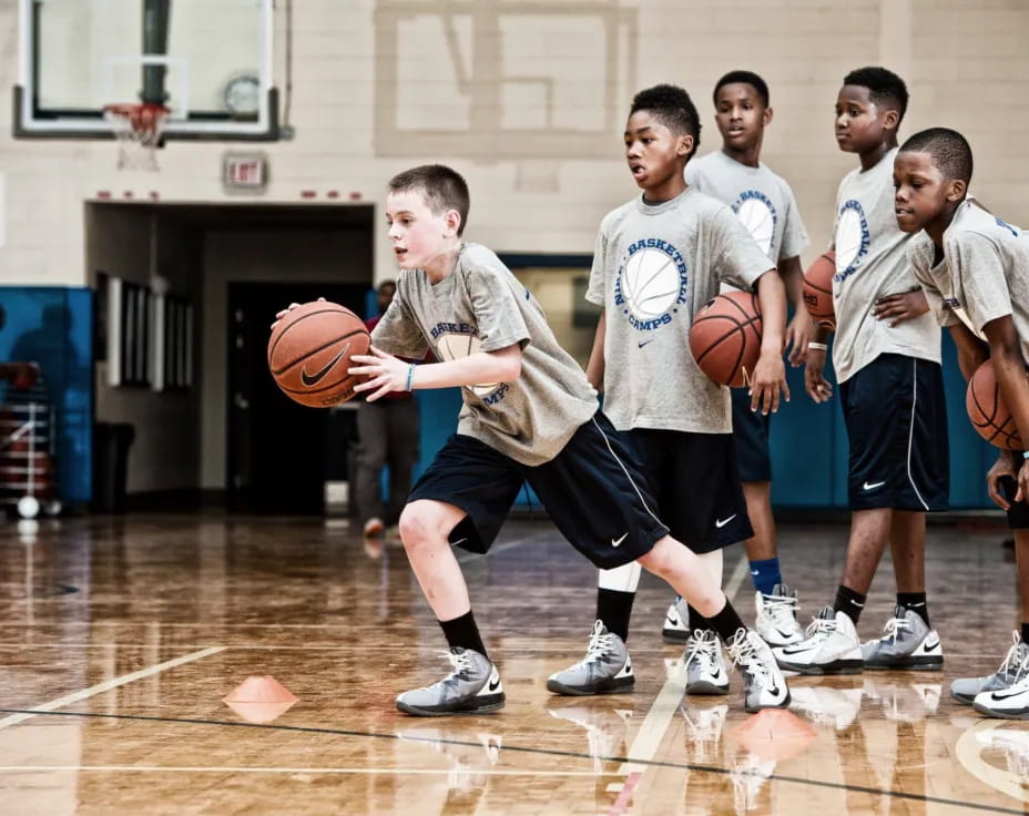 a group of boys playing basketball
