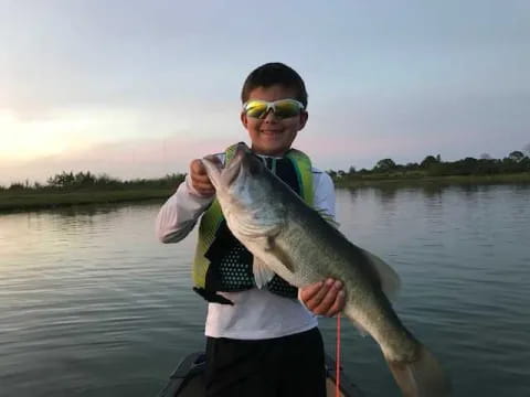 a man holding a fish